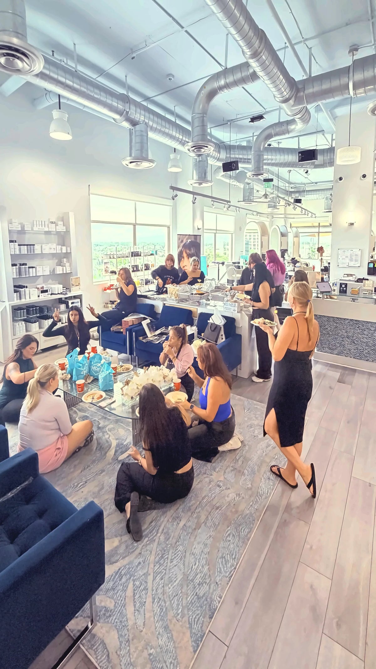 The Salon Sora lounge and reception with city-view windows on the 7th floor